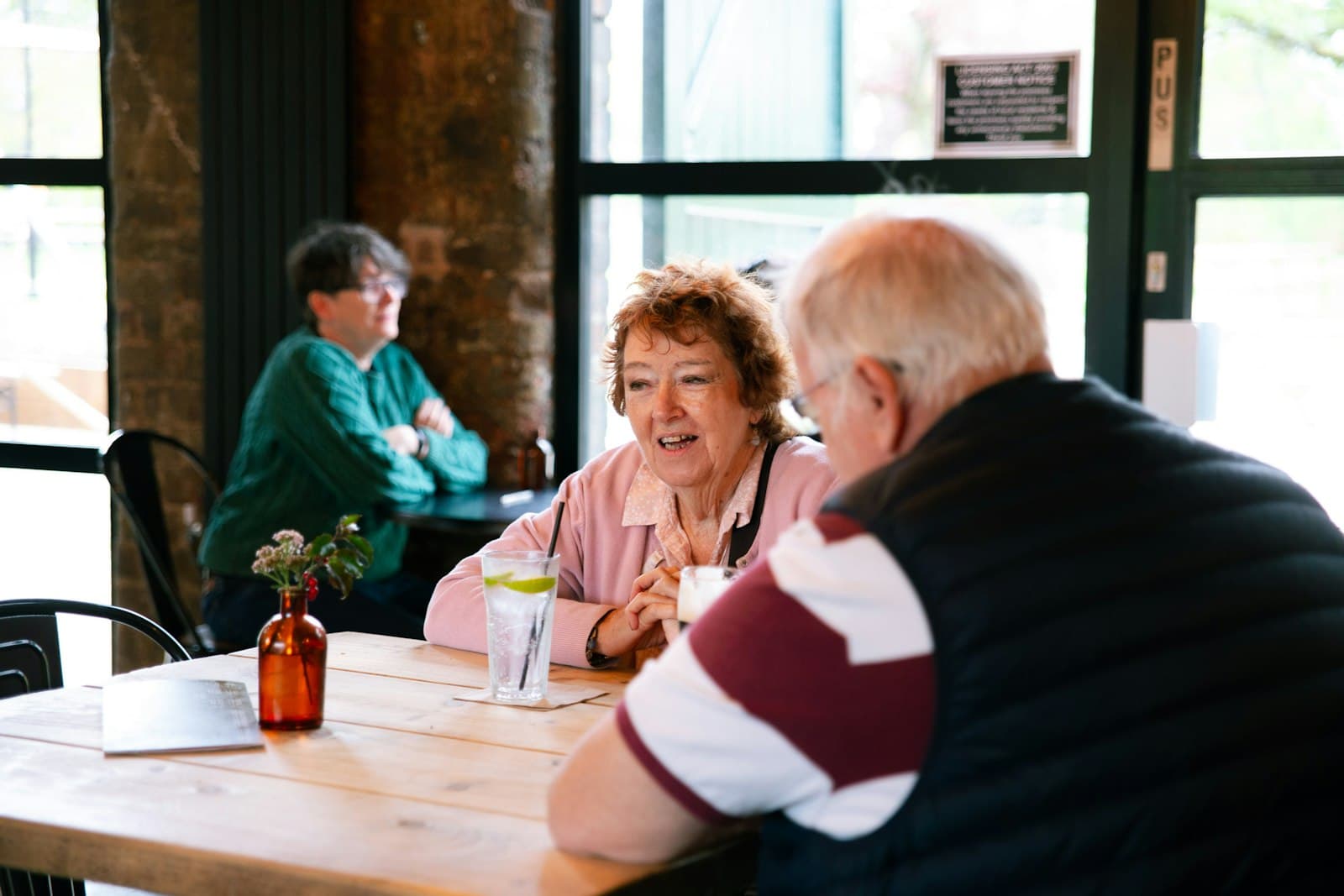 Support worker in conversation with a family member