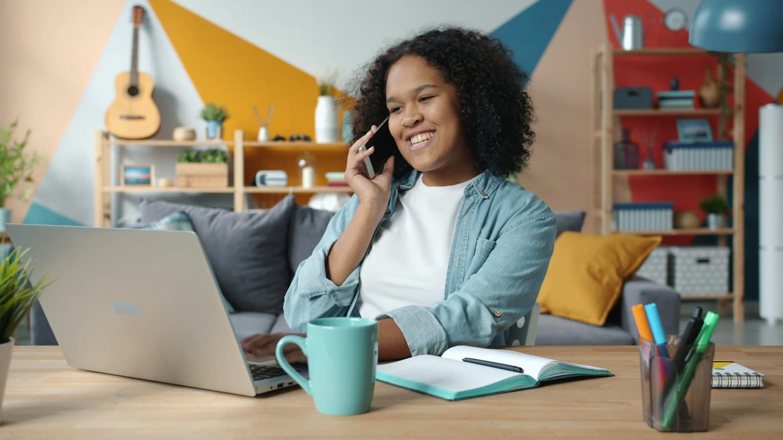 A support worker on a phone call, smiling